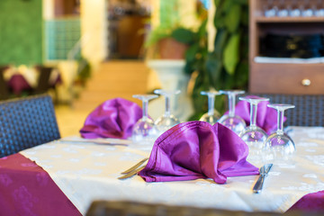 Served table set at restaraunt in the evening