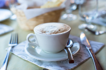 Delicious and tasty cappuccino for breakfast at a cafe in the