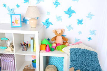 Colorful toys on fluffy carpet in children room