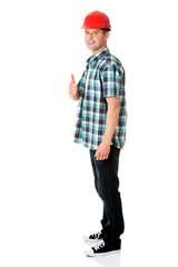 Portrait of a builder in a white helmet