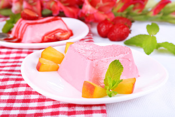 Cakes with fruit and berries on plate on napkin
