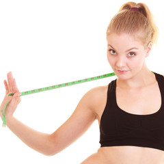 Fototapeta na wymiar Diet. Fitness woman fit girl with measure tape