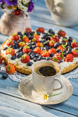 Coffee and fruit tarts served in the garden