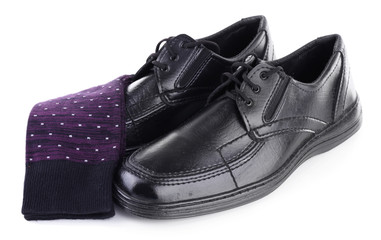 Black man's shoes and socks isolated on white