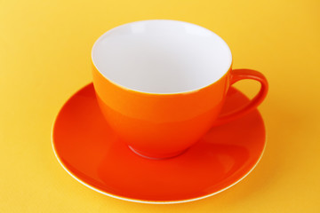 Colorful cup on color background