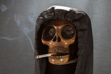Human skull smoking a cigarette on a black background