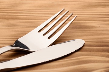 Knife and fork set on a wooden vintage table