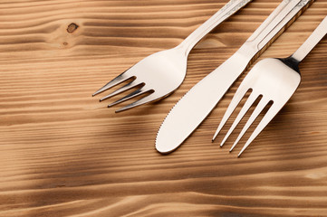 Knife and fork set on a wooden vintage table