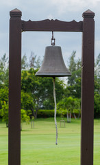 Obraz premium Bell with pillar wood in golf course