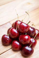 Fresh red Cherries on wooden table