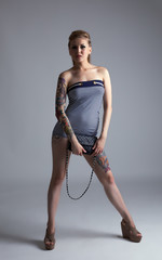 Hot tattooed woman posing looking at camera