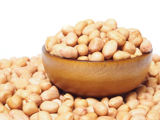 Dried peanut in wooden bowl isolated on white background