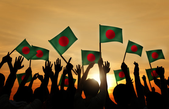 Silhouettes of People Holding Flag of Bangladesh