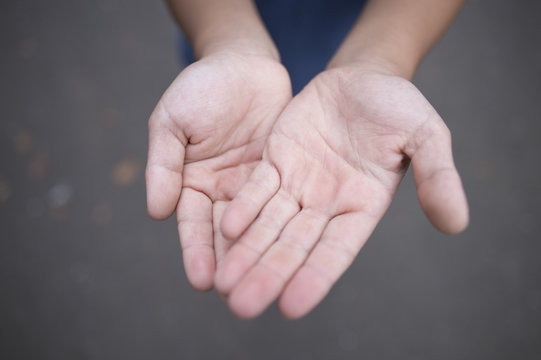 Child's hands outside
