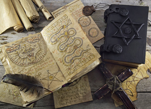 Still life with magic objects and books