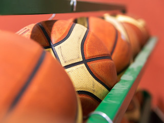 Fototapeta premium row of basket balls in gymnasium