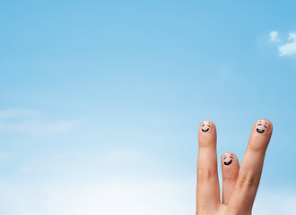 Happy smiley fingers looking at clear blue sky copyspace