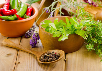 Fresh herbs on a wooden background