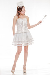 Beautiful Asian Woman in Angel Costume waving wand
