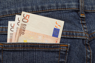 three banknotes of 50 euro in jeans pocket