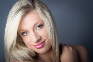 Naklejka premium Sensual Looking Blond with green eyes, smling
