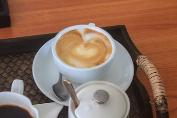 cappuccino coffee on wooden table