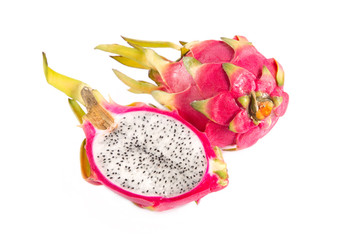 Top view of cut section of dragon fruit and a whole one