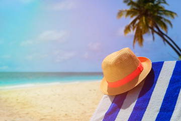 hat on tropical sand beach