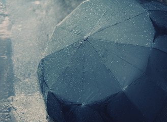 Rainy autumn day, wet umbrella