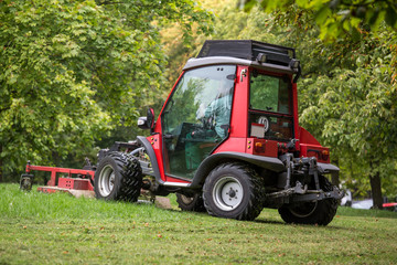 ride on mowers in a park