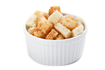 Bowl of  croutons  isolated on a white background