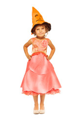 Girl in dress with orange Halloween hat