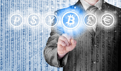 Choosing bitcoins, businessman pressing touch screen button.