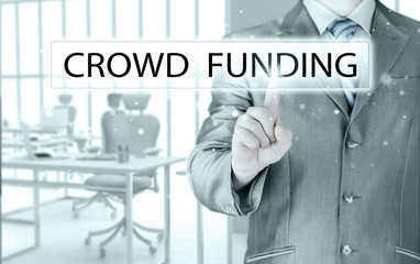 Businessman pushes virtual crowd funding button