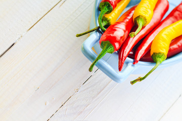 Background colorful peppers blue bowl