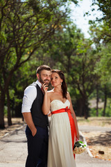 European bride and groom kissing in the park