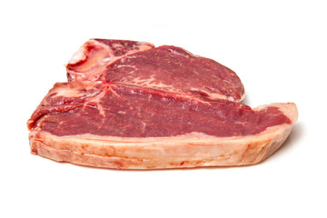 T-bone steak isolated on a white studio background.