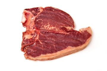 T-bone steak isolated on a white studio background.