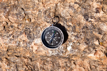 Compass on a stone background