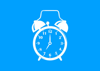 White alarm clock on blue background
