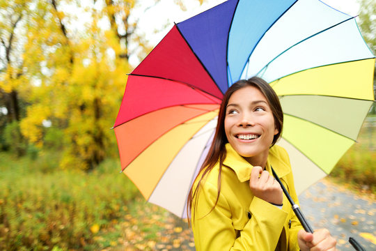 Autumn / fall - woman happy with umbrella in rain