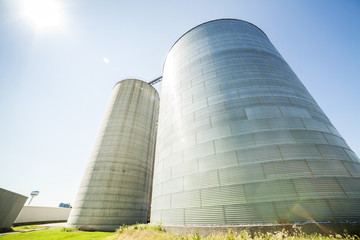 Silver, shiny agricultural silos