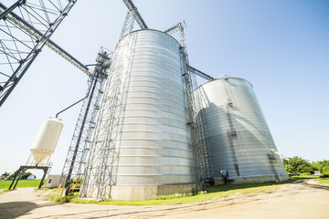 Silver, shiny agricultural silos