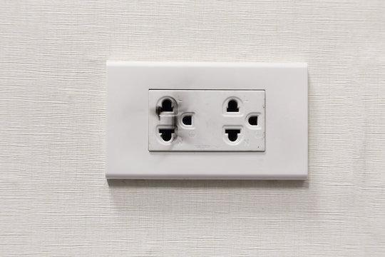 Burning Electric Plug Socket On The Wall