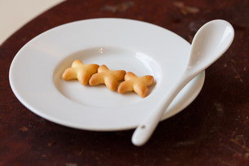 Sweet cookies on white plate, Sex on plate