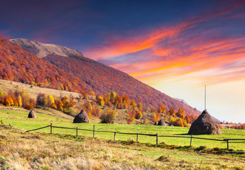 Colorful autumn sunrise in the mountain village