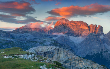 Fototapeta na wymiar Colorful summer sunrise in Italy Alps, Tre Cime Di Lavaredo, Dol