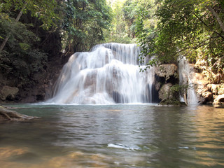 Fototapeta na wymiar Water fall in spring season located in deep rain forest jungle