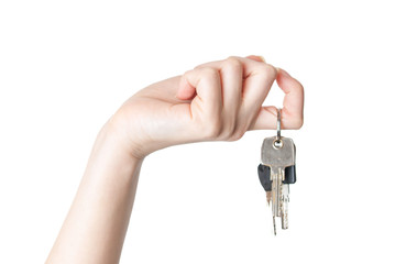female hand holding a key isolated