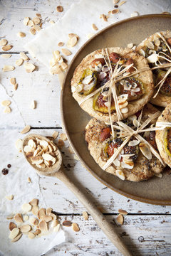 homemade rustic cookies with figs and almond slices on plate